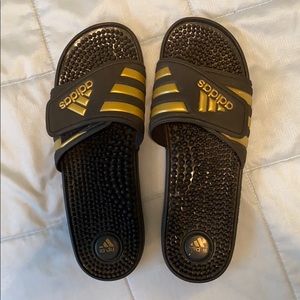 Adidas black and gold slides